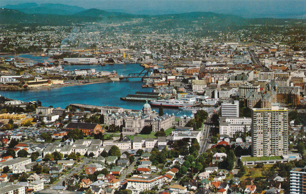 Aerial photograph of Victoria, BC, Canada showing Victoria harbour, buildings and hills on the horizon
